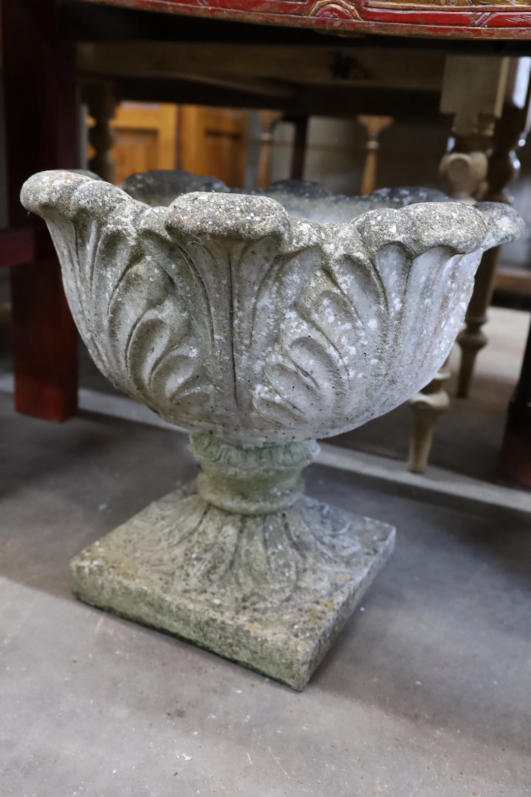 A pair of circular reconstituted stone garden planters moulded with acanthus leaves, diameter 50cm, height 43cm